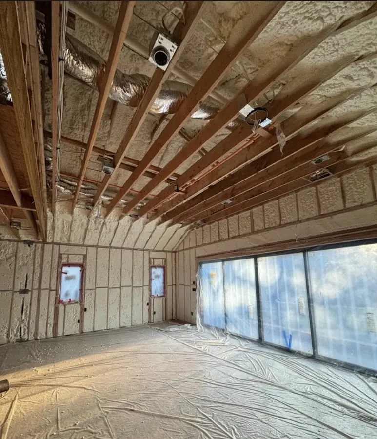 Interior walls and ceiling insulated with spray foam during new construction in Hampshire